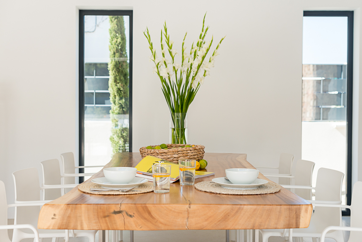 Resa estate modern villa for sale ibiza first line north diuning table detail.jpg